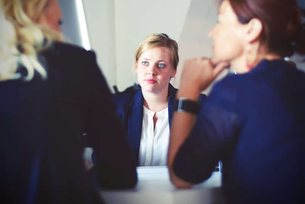 Woman talking with investors